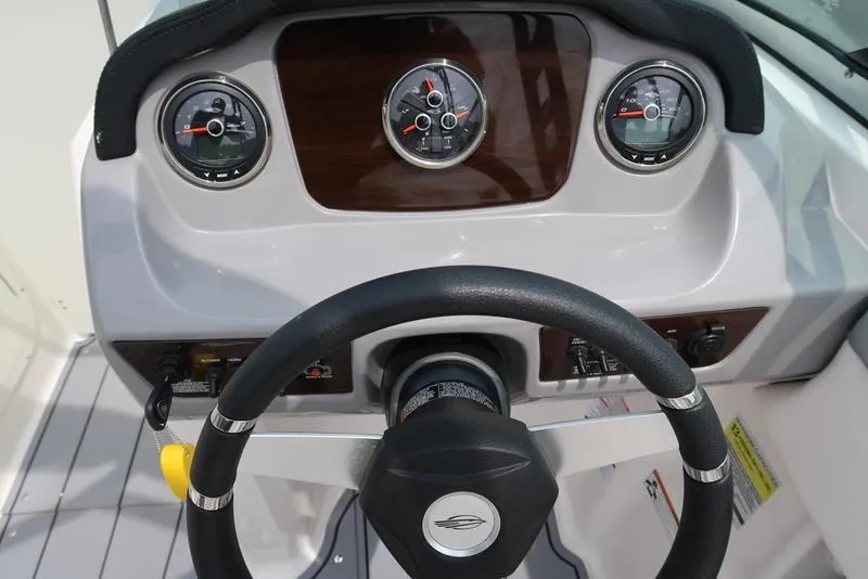 Slide: The Image of Dashboard of 2021 Chaparral 23 SSi boat with steering wheel and gauges. - 12