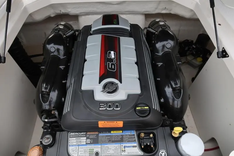 Slide: The Image of 2021 Chaparral 23 SSi boat engine, featuring a powerful 6.2L Mercury 300 horsepower motor. - 16
