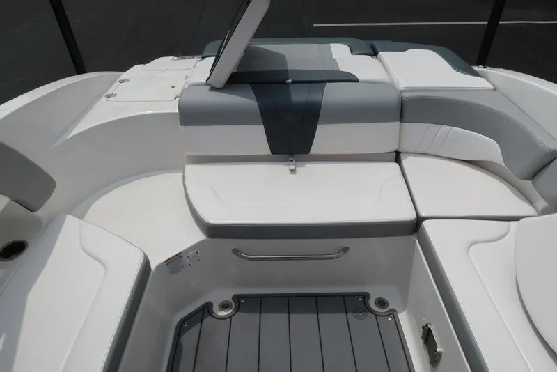 Slide: The Image of 2021 Chaparral 23 SSi boat interior with white and gray seating arrangement. - 18