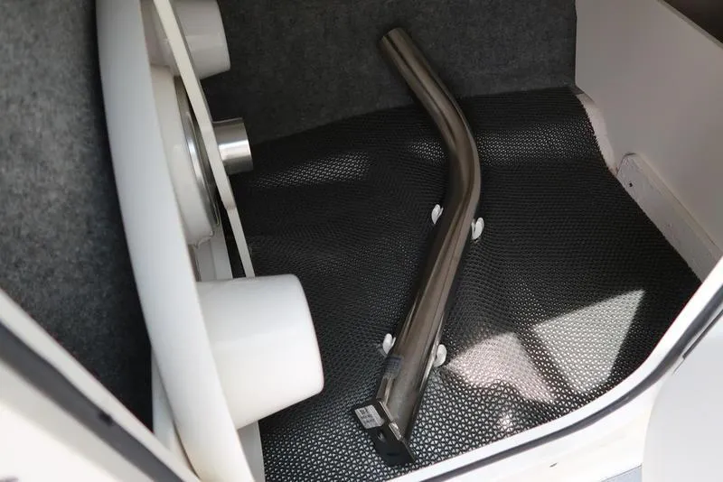 Slide: The Image of Storage compartment of 2021 Chaparral 23 SSi boat with metal pipe inside. - 20