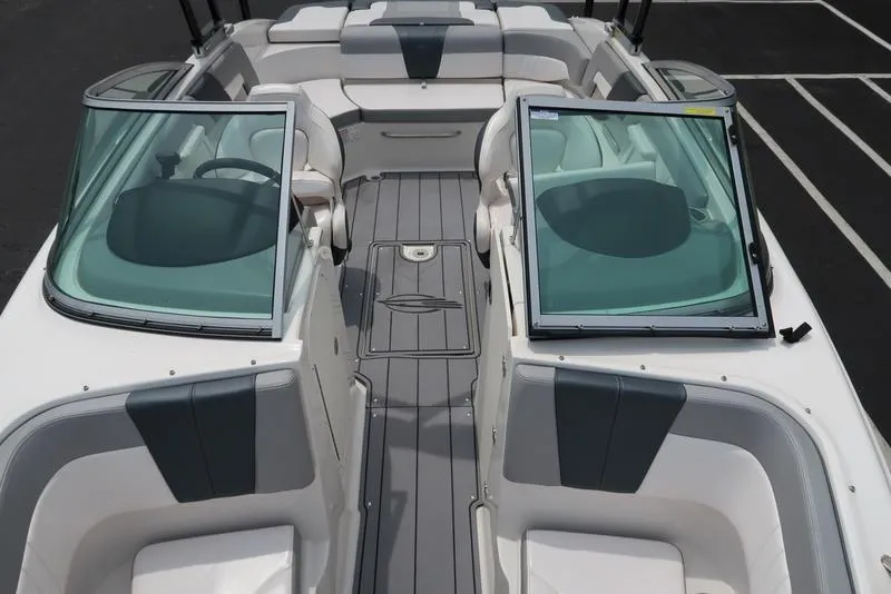 Slide: The Image of 2021 Chaparral 23 SSi boat interior with open windshield and seating area. - 22