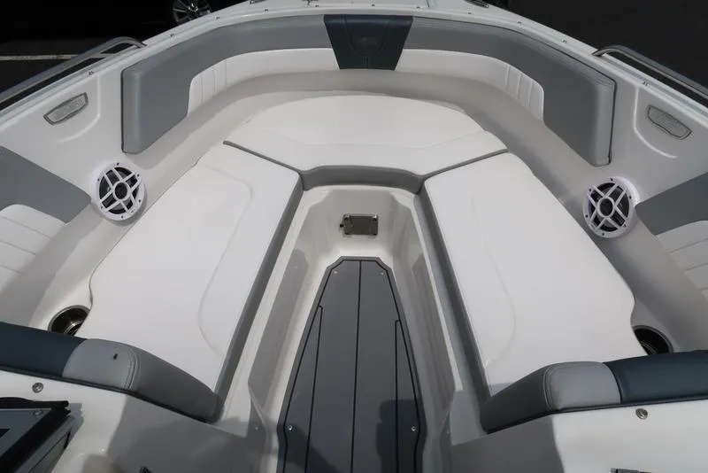 Slide: The Image of 2021 Chaparral 23 SSi boat interior with white and gray seating. - 25