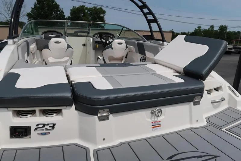 Slide: The Image of 2021 Chaparral 23 SSi boat interior with seating and dashboard view. - 5