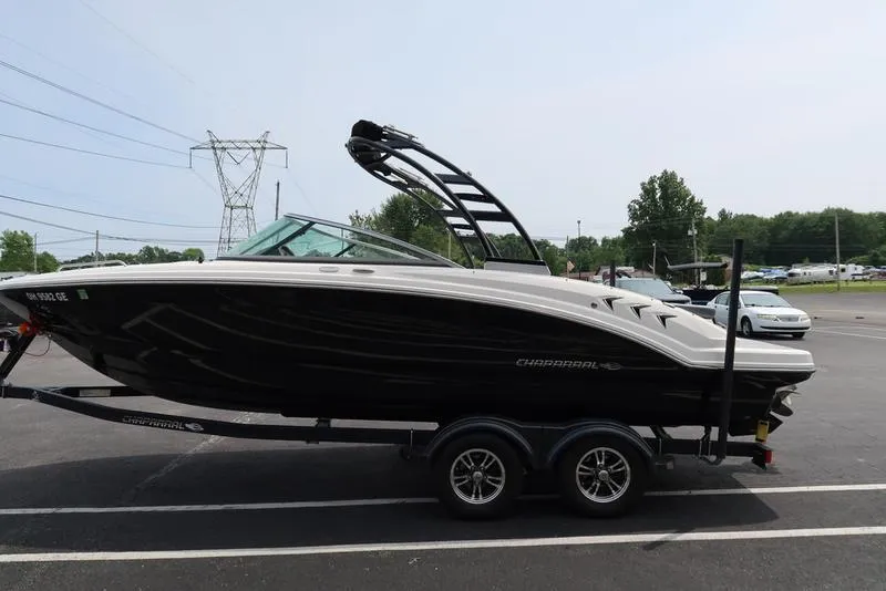 Slide: The Image of 2021 Chaparral 23 SSi boat on trailer in parking lot, side view. - 7