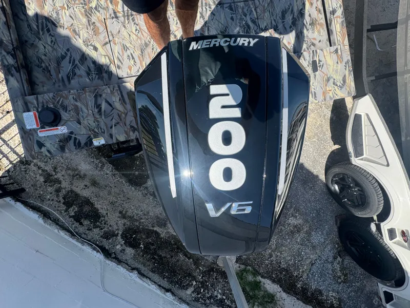 Slide: The Image of Mercury 200 V6 outboard motor on Ranger RB210, 2025 model, top view. - 13