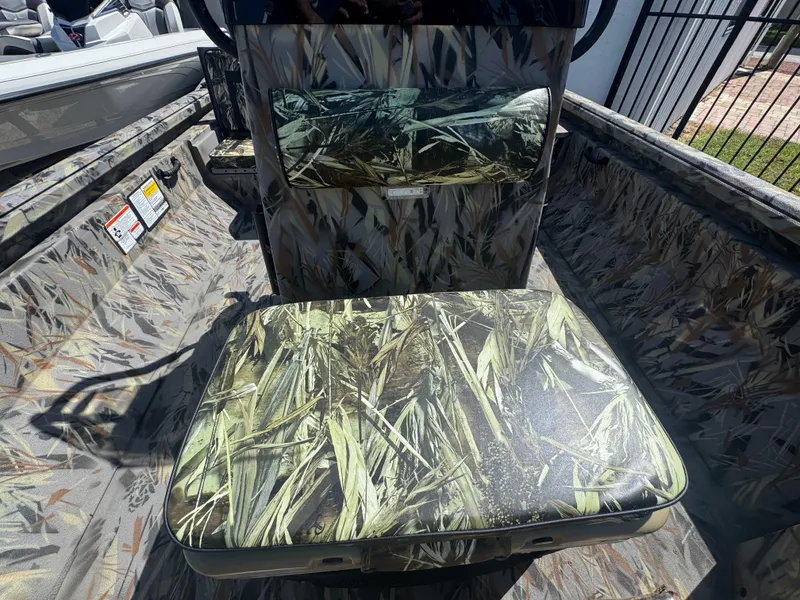 Slide: The Image of 2025 Ranger RB210 boat interior with camouflage seating and design. - 7