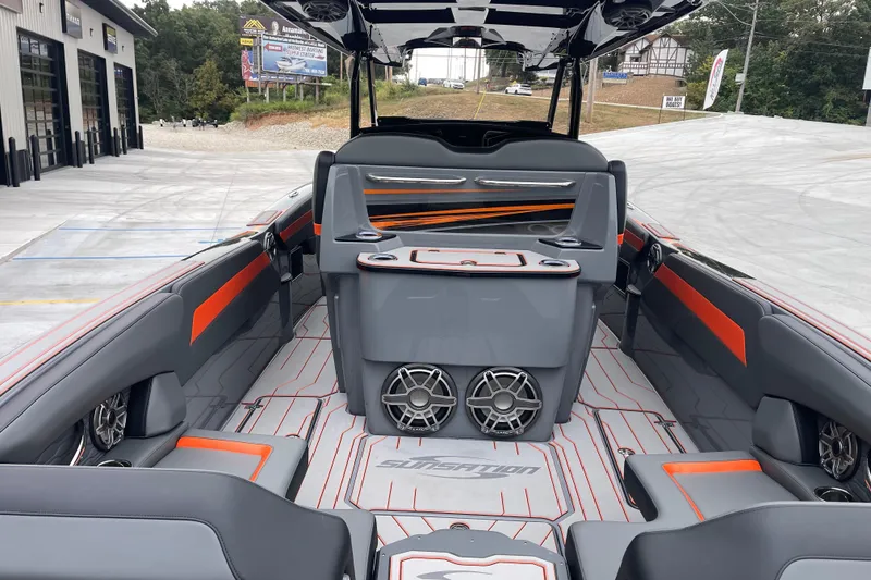 Slide: The Image of 2025 Sunsation 32 CCX boat interior with modern seating and audio system. - 12