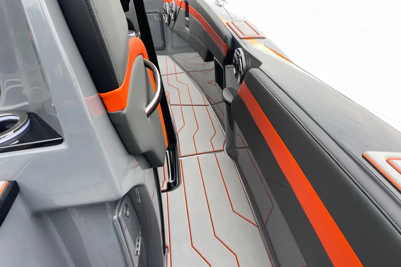 Slide: The Image of Interior of 2025 Sunsation 32 CCX boat with sleek gray and orange design. - 17