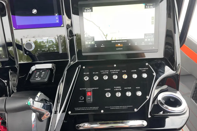 Slide: The Image of 2025 Sunsation 32 CCX dashboard with Garmin navigation and control panel. - 20