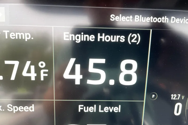 Slide: The Image of Display screen showing engine hours and temperature on 2025 Sunsation 32 CCX. - 21