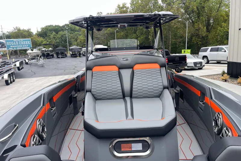 Slide: The Image of 2025 Sunsation 32 CCX boat interior with modern seating and sleek design. - 23