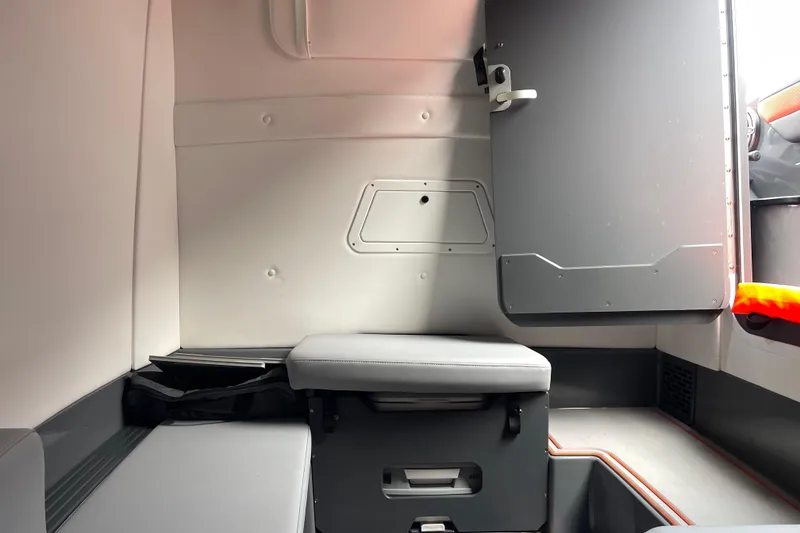 Slide: The Image of 2025 Sunsation 32 CCX cabin interior with seating and storage compartments. - 26