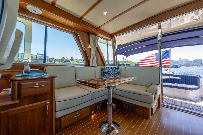 Slide: The Image of Interior of 2014 Sabre 48 Salon Express yacht with elegant seating and scenic water view. - 17