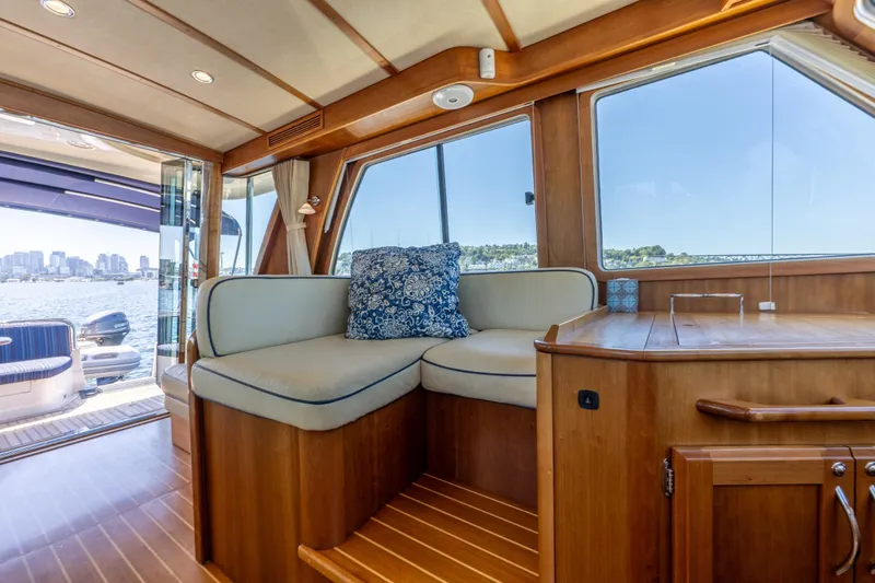 Slide: The Image of Interior of 2014 Sabre 48 Salon Express yacht with elegant wood finish and waterfront view. - 18