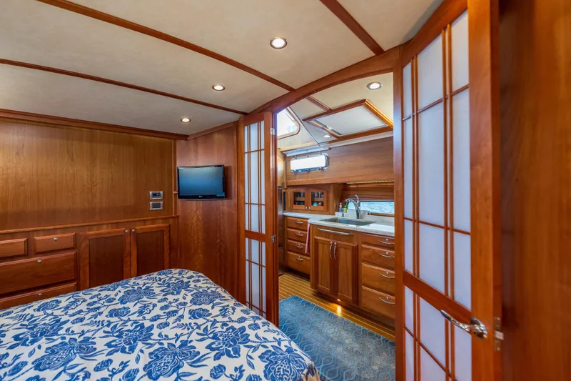 Slide: The Image of Luxurious 2014 Sabre 48 Salon Express interior with wood finish and modern amenities. - 30