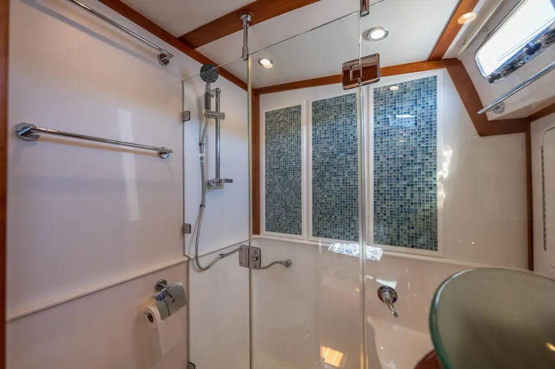 Slide: The Image of Luxurious bathroom in 2014 Sabre 48 Salon Express yacht with glass shower and mosaic tiles. - 35