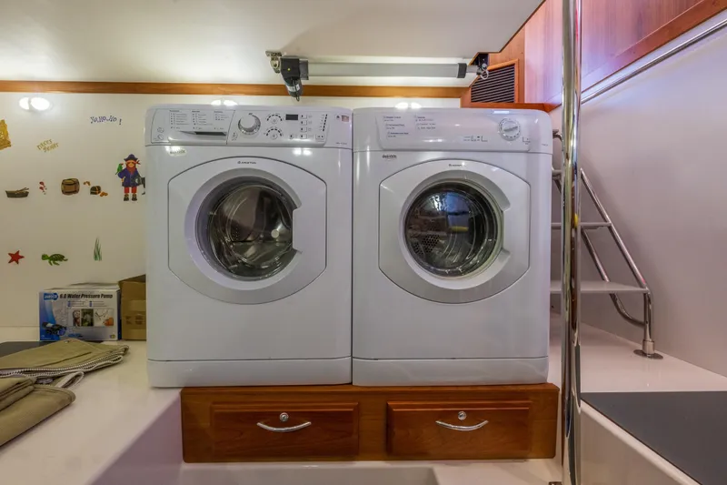 Slide: The Image of Laundry area with washer and dryer on 2014 Sabre 48 Salon Express yacht. - 38