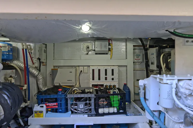 Slide: The Image of Engine room of 2014 Sabre 48 Salon Express with electrical panels and maintenance supplies. - 42