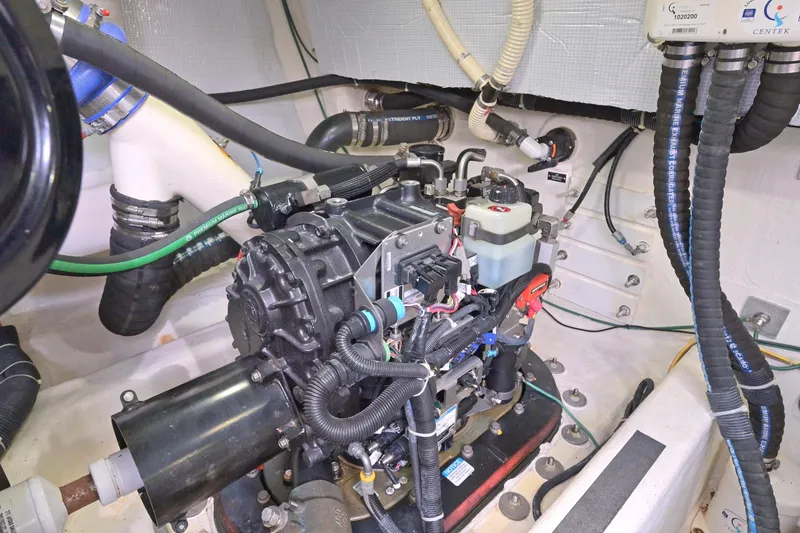 Slide: The Image of Engine room of 2014 Sabre 48 Salon Express with visible mechanical components and wiring. - 44