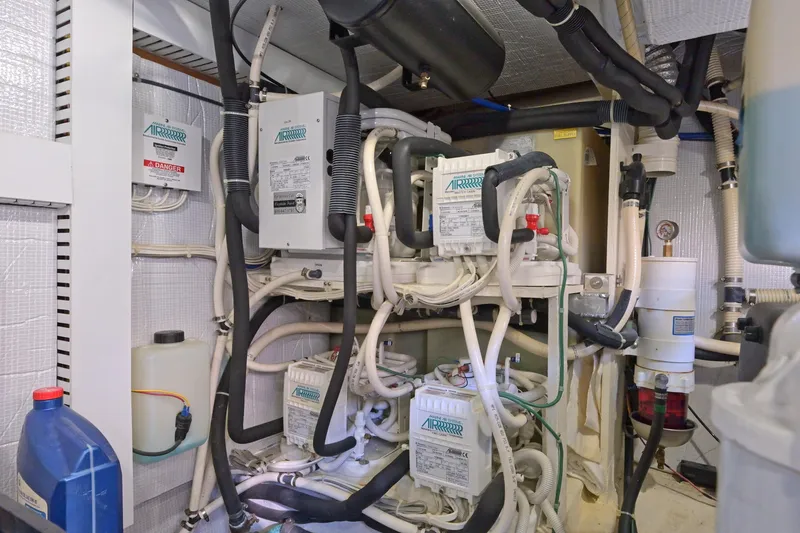 Slide: The Image of Engine room of 2014 Sabre 48 Salon Express with complex wiring and equipment. - 45