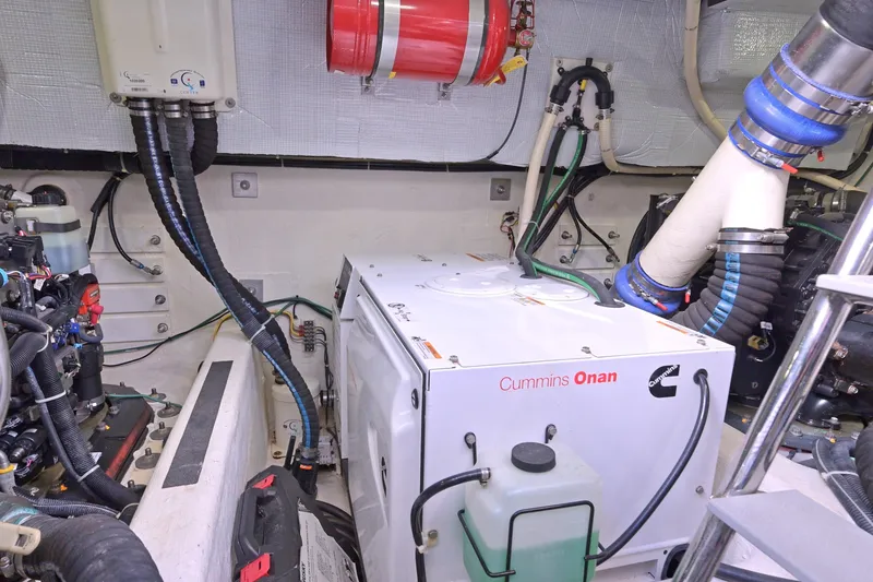 Slide: The Image of Engine room of 2014 Sabre 48 Salon Express with Cummins Onan generator. - 46