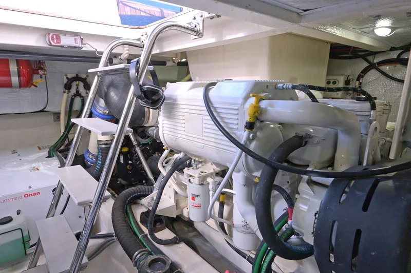 Slide: The Image of Engine room of 2014 Sabre 48 Salon Express with Cummins Onan generator and mechanical components. - 48