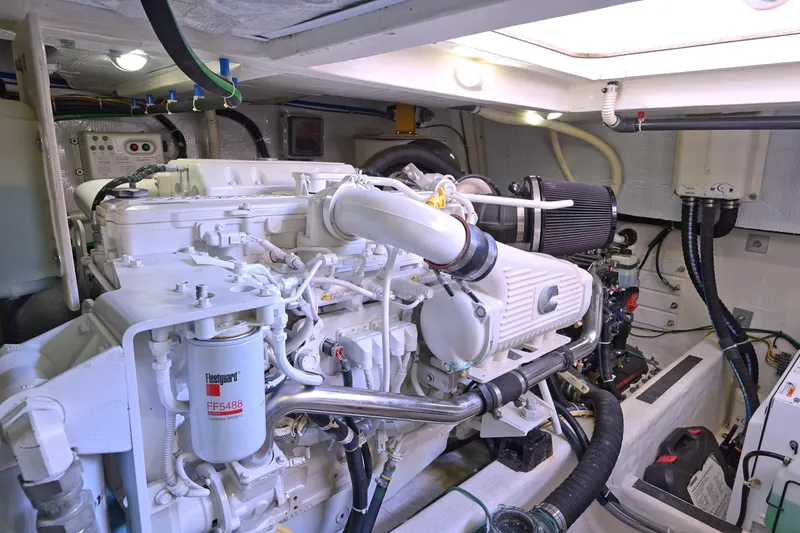 Slide: The Image of Engine room of 2014 Sabre 48 Salon Express, showcasing detailed mechanical components. - 49