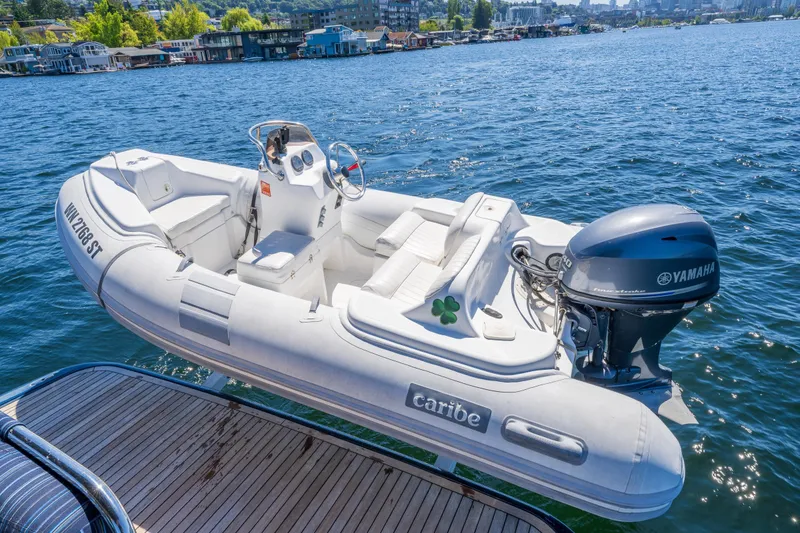 Slide: The Image of Inflatable boat with Yamaha motor on water, near Sabre 48 Salon Express, 2014 model. - 51