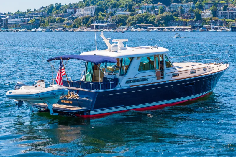 Slide: The Image of 2014 Sabre 48 Salon Express with Caribe inflatable and Freedom Lift - 9