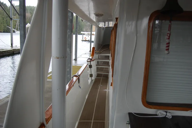 Slide: The Image of Side deck view of 1979 Ocean Alexander Mark 1 55 yacht at dock. - 14