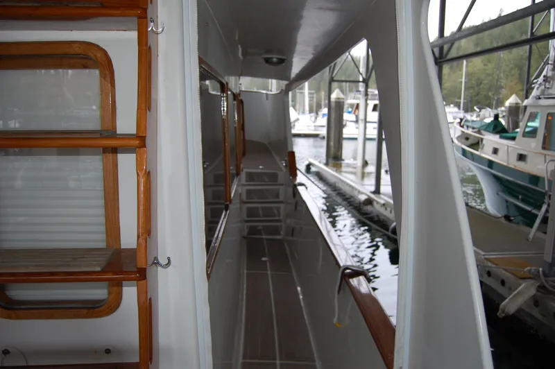 Slide: The Image of 1979 Ocean Alexander Mark 1 55 yacht side deck view at marina. - 15