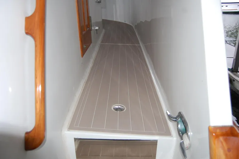 Slide: The Image of 1979 Ocean Alexander Mark 1 55 yacht deck with wood accents and sleek design. - 16