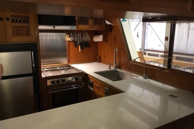 Slide: The Image of Interior kitchen of 1979 Ocean Alexander Mark 1 55 yacht with modern appliances. - 23