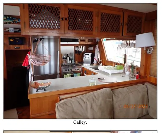 Slide: The Image of Galley of 1979 Ocean Alexander Mark 1 55 yacht with wooden cabinetry and modern appliances. - 26