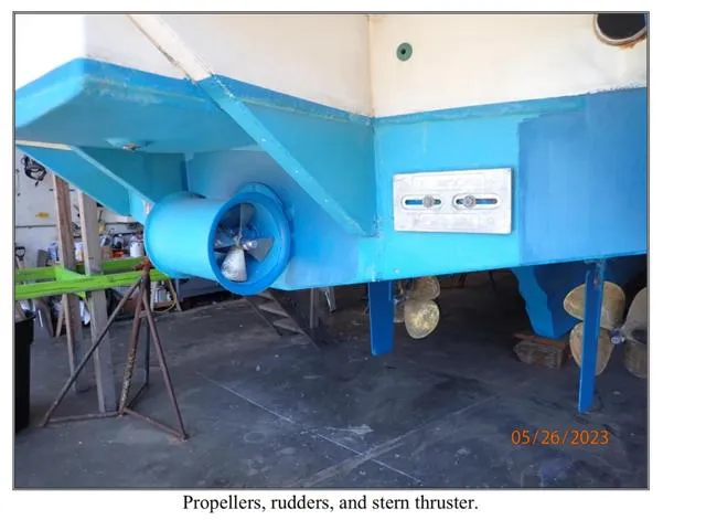 Slide: The Image of 1979 Ocean Alexander Mark 1 55 boat with propellers, rudders, and stern thruster in dry dock. - 35