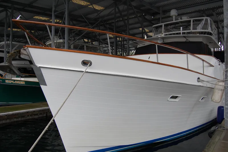 Slide: The Image of 1979 Ocean Alexander Mark 1 55 yacht docked in a covered marina. - 36