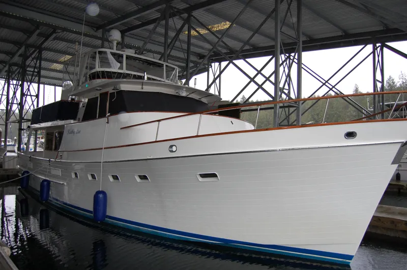 Slide: The Image of Ocean Alexander Mark 1 55 yacht, 1979 model, docked under a covered marina. - 37