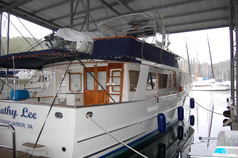 Slide: The Image of 1979 Ocean Alexander Mark 1 55 yacht docked in a covered marina. - 5