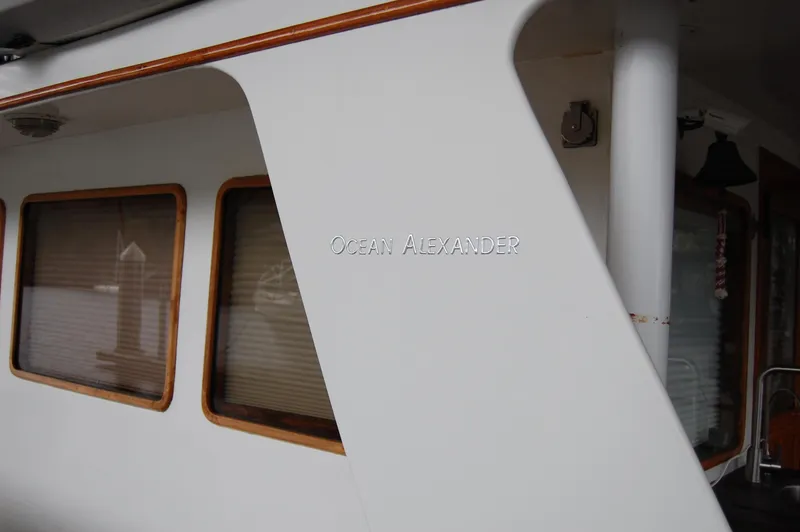 Slide: The Image of 1979 Ocean Alexander Mark 1 55 yacht exterior with windows and branding. - 7