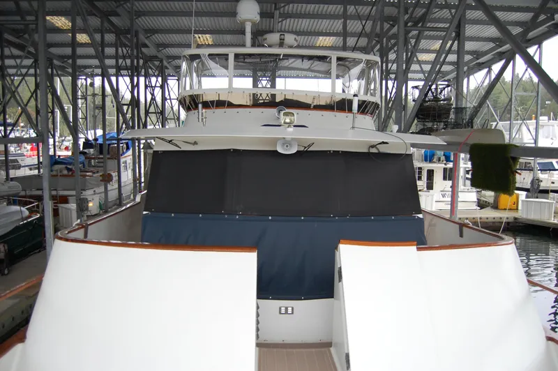 Slide: The Image of 1979 Ocean Alexander Mark 1 55 yacht docked in a covered marina. - 9