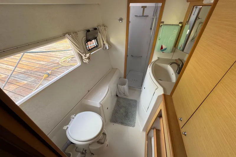 Slide: The Image of Bathroom interior of 2008 Lagoon 420 yacht with shower, sink, and toilet. - 22