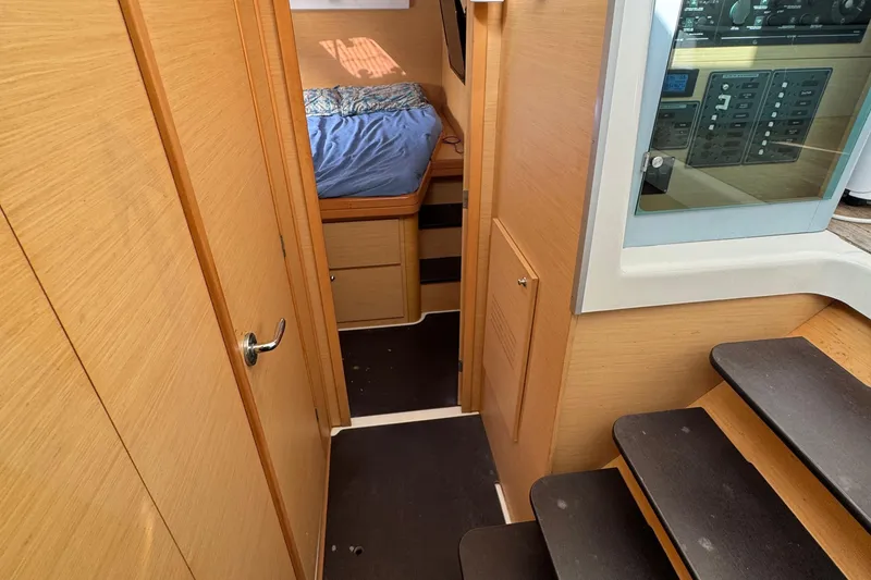 Slide: The Image of Interior of 2008 Lagoon 420 yacht showing cabin, stairs, and control panel. - 35