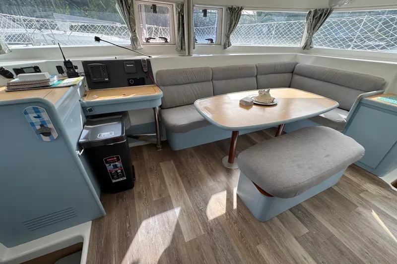 Slide: The Image of Interior of 2008 Lagoon 420 yacht with cozy seating and navigation area. - 38