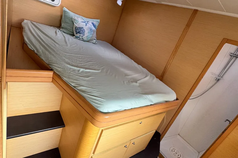Slide: The Image of Cozy cabin interior of 2008 Lagoon 420 yacht with bed and shower. - 45
