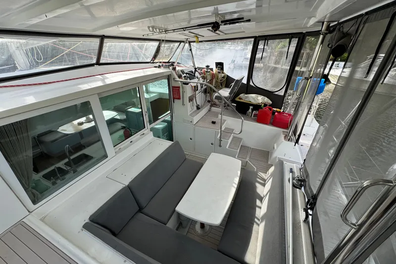 Slide: The Image of Interior view of 2008 Lagoon 420 catamaran with seating and navigation area. - 5