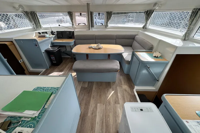 Slide: The Image of Interior of 2008 Lagoon 420 catamaran with modern seating and navigation area. - 7