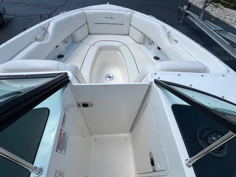 Slide: The Image of 2007 Sea Ray 270 SLX boat interior with white seating and open windshield. - 10