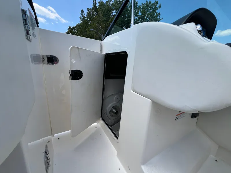 Slide: The Image of Open storage compartment on 2007 Sea Ray 270 SLX boat, showcasing interior space. - 12