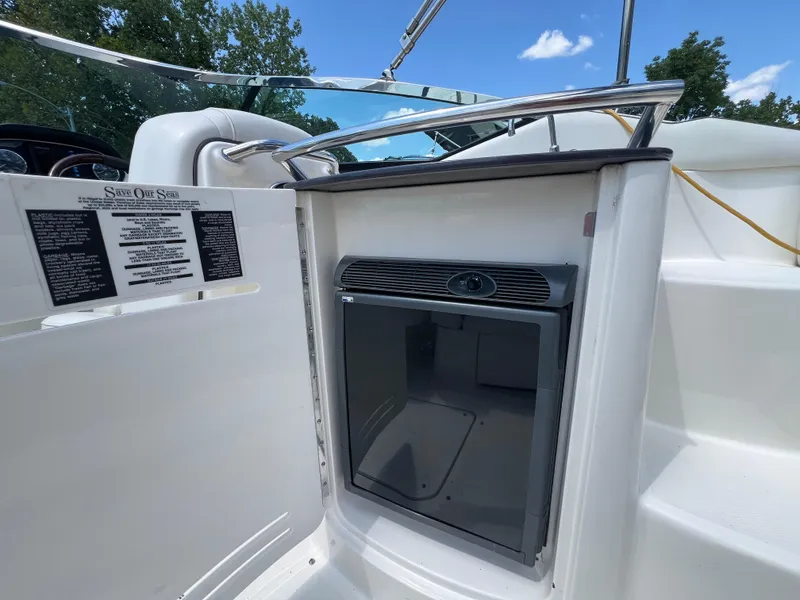 Slide: The Image of 2007 Sea Ray 270 SLX boat interior with mini fridge and safety instructions. - 17