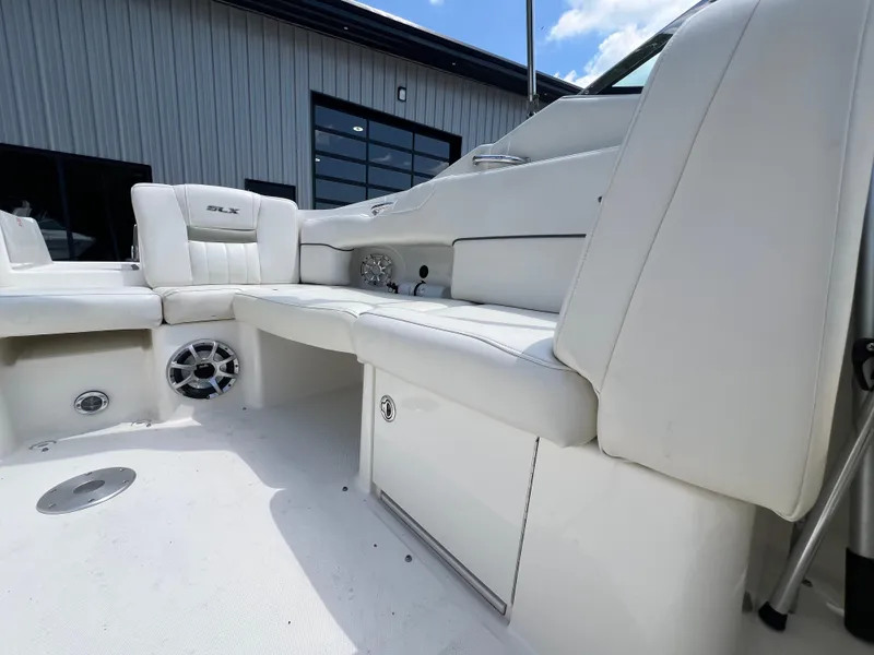 Slide: The Image of 2007 Sea Ray 270 SLX boat interior with white seating and speaker system. - 19